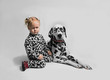 Little girl friends with Dalmatian dog